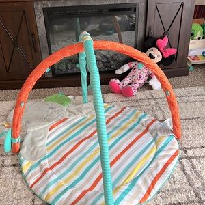Baby tummy time play mat. Includes sensory ribbons. Loops additional attachments